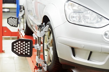 car undergoing a four wheel alignment service